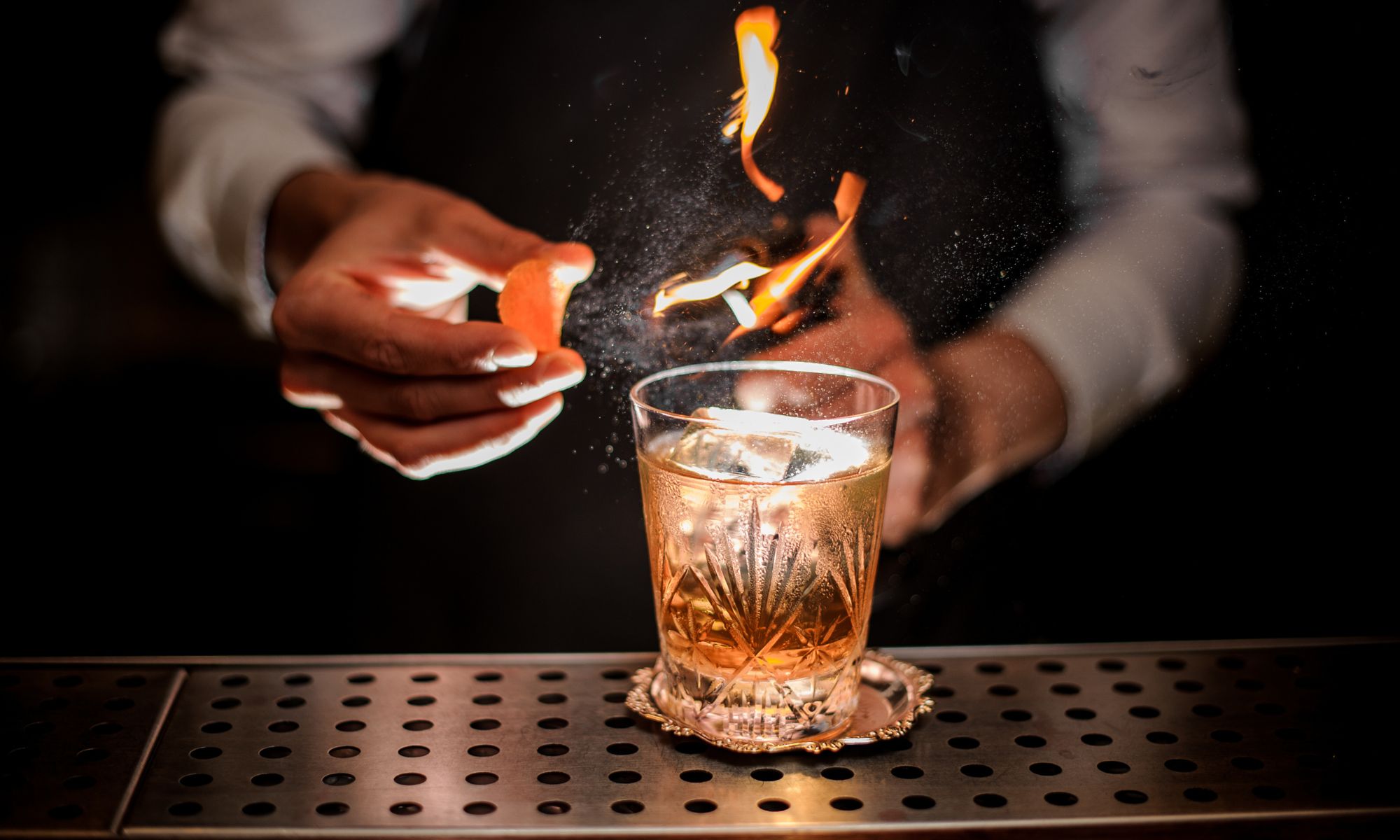 bartender making a drink with fire